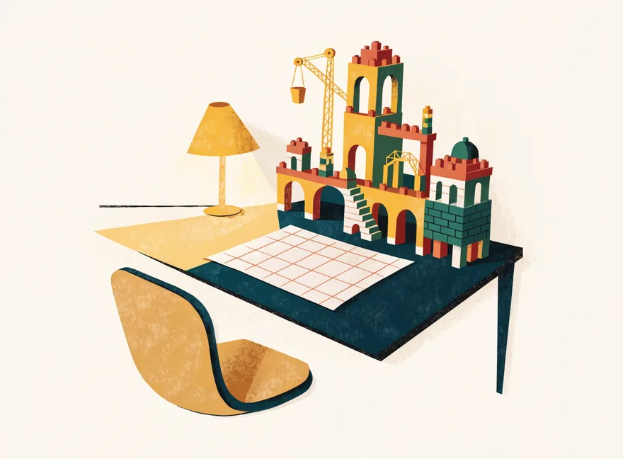 A toy-brick city built beside an untouched worksheet